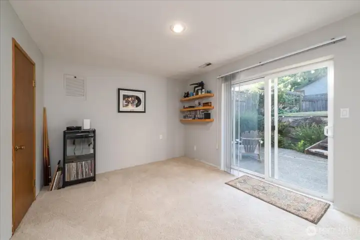The lower level bonus room opens out to the private lower patio for enjoying a quiet evening.