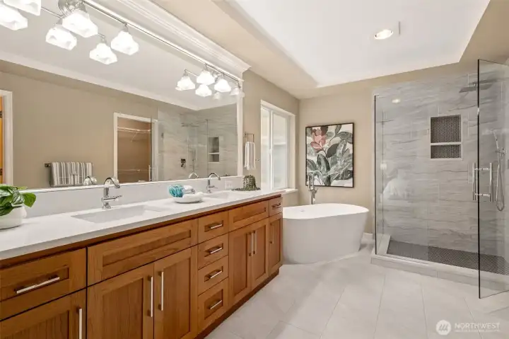 The updated 5 piece primary bathroom that includes a walk-in closet to the right (not seen in this picture).