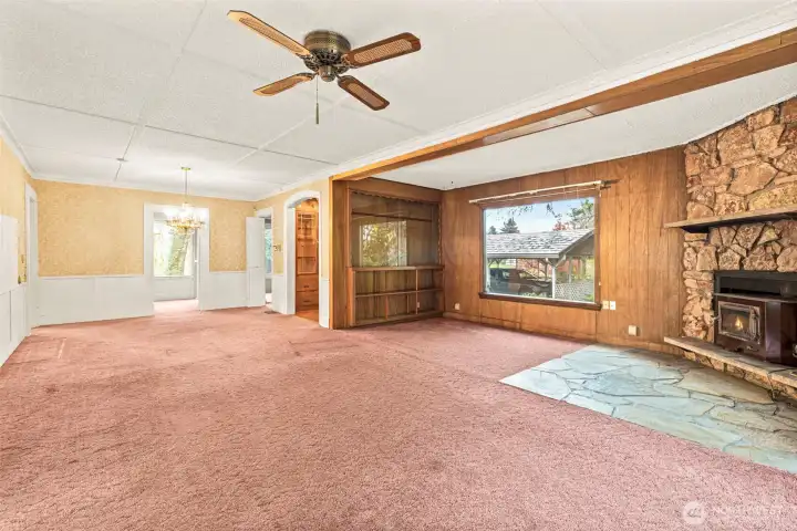 Spacious living room with wood burning fireplace. See renovation boards at house for ideas for a fresh look.