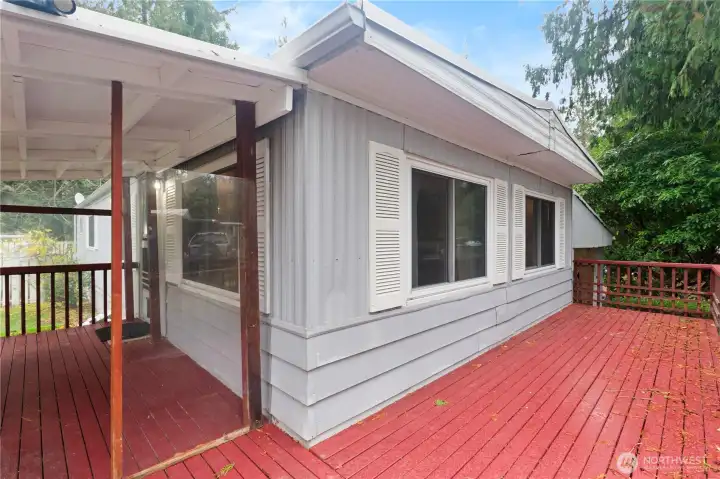 Large deck - Partially covered for year round enjoyment.
