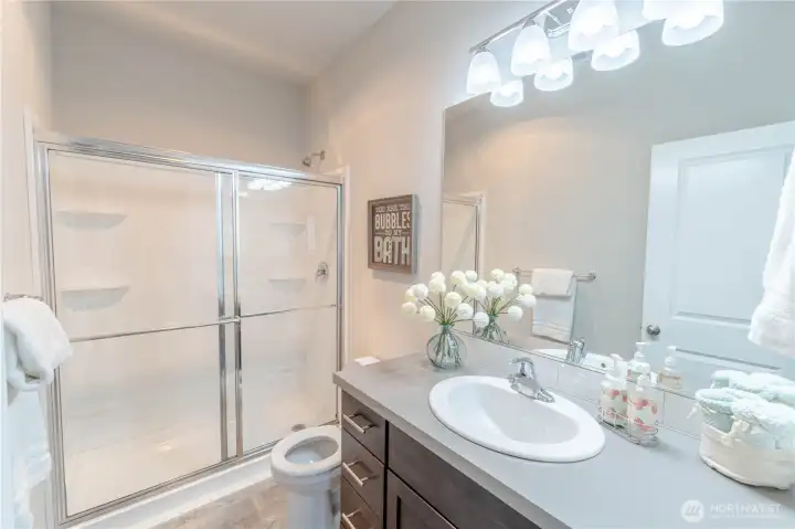 Main three-quarter bathroom located between bedrooms one and two.