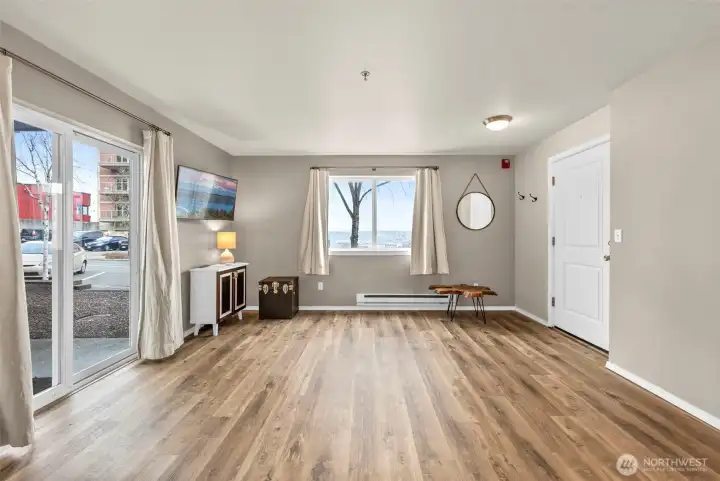 Lots of natural light and amazing views from living room window. Lots of natural light and amazing views from living room window.