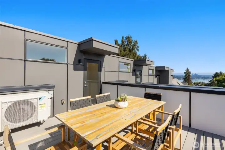 Host unforgettable gatherings on the rooftop deck, equipped with a built-in outdoor kitchen and prep space