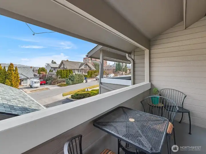 Covered deck with beautiful city and mountain views