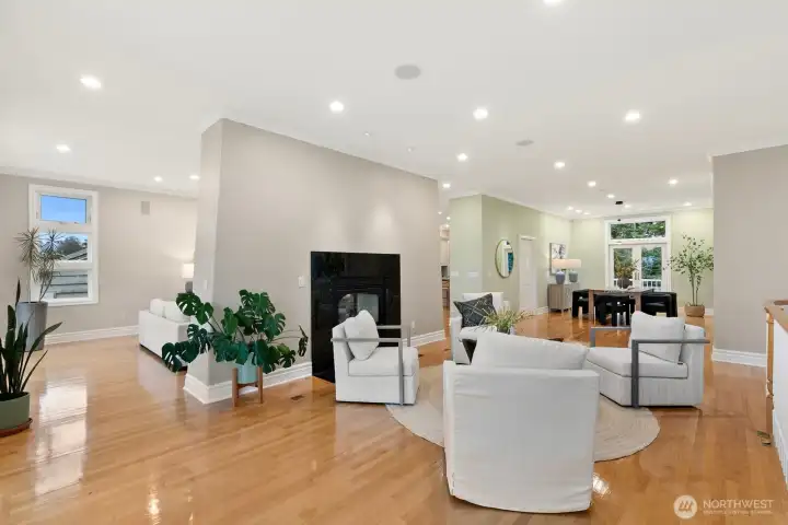 The gas fireplace operates in both the formal living room and the flex space off of the kitchen. Note the formal dining room off to the right here.