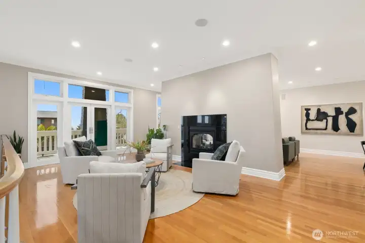 The french doors lead to one of two large decks. The entrance to the kitchen and flex room are pictured to the right here.