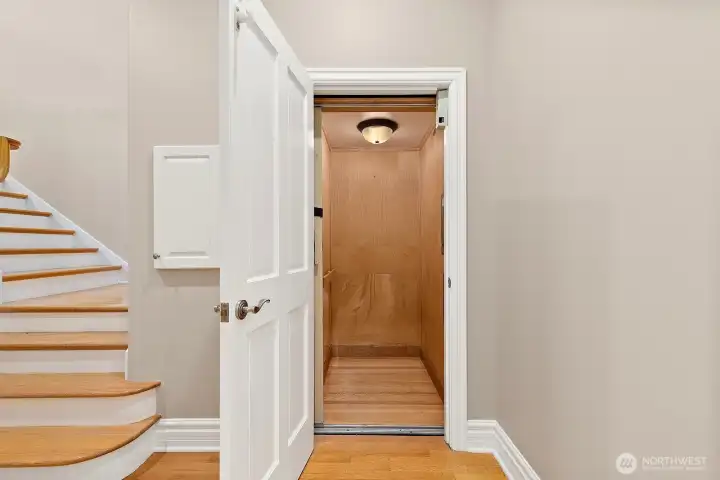 The glorious elevator - this goes to all four floors. Accommodating for guest, groceries, aging in place, etc. This feature makes this home approachable for all! Living floor powder room is to the left in this photo. Stairs lead to the top level.