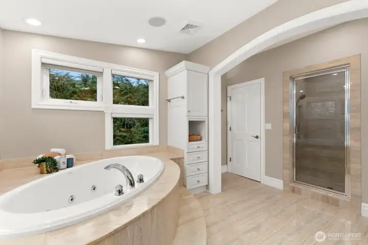 Note the water closet ahead in this photo as well as the walk-in STEAM shower.