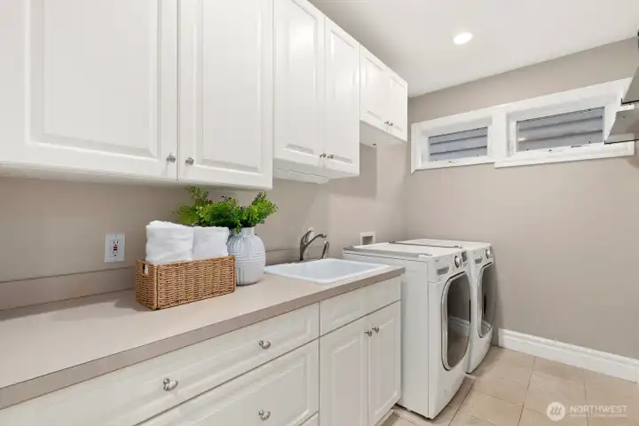 Laundry room on the main/entry level. This is one of three laundry hook ups. There is one in the Primary (north) closet and one in the storage room off the garage.