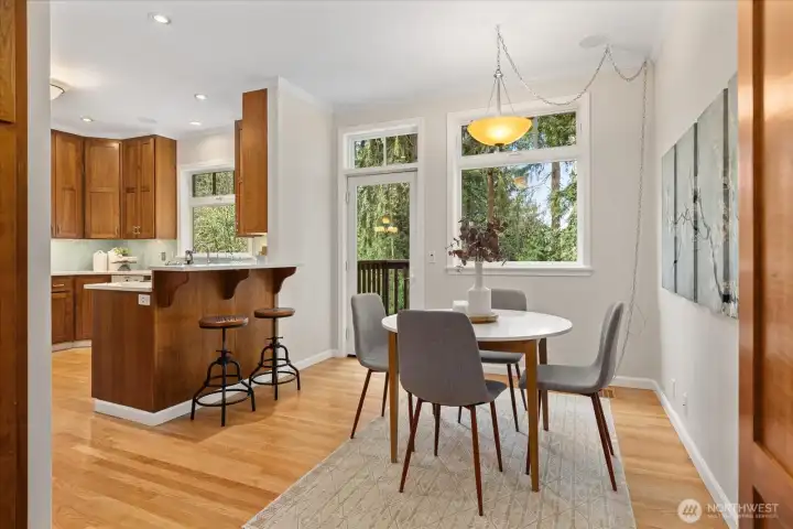 The kitchen and dining spaces are bright, cheery and full of natural light