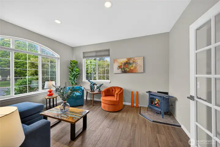 Office or Den with huge picture windows, French doors and a gas stove for a cozy, warm relaxing evenings.