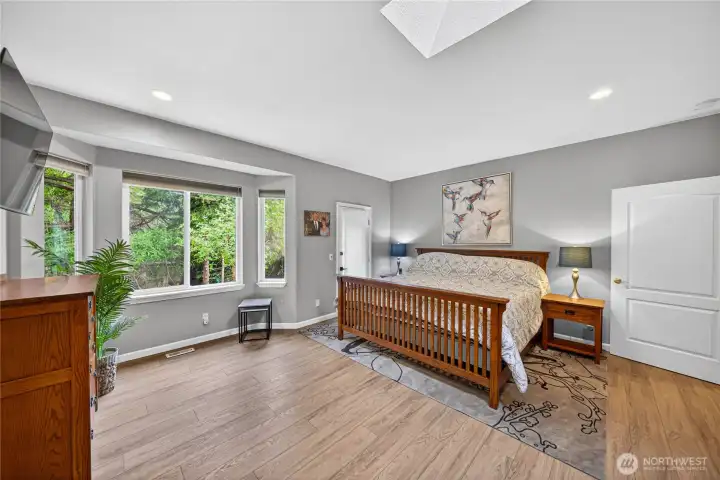 The primary Bedroom has brand new paint and LVP flooring. There are large windows and a huge Skylight for natural light.
