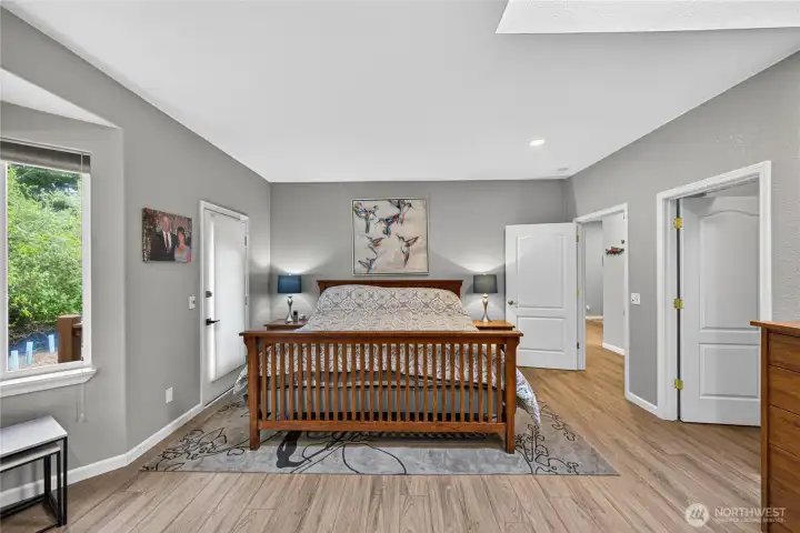 Primary Bedroom with the walk-in closet with the open door on the right.