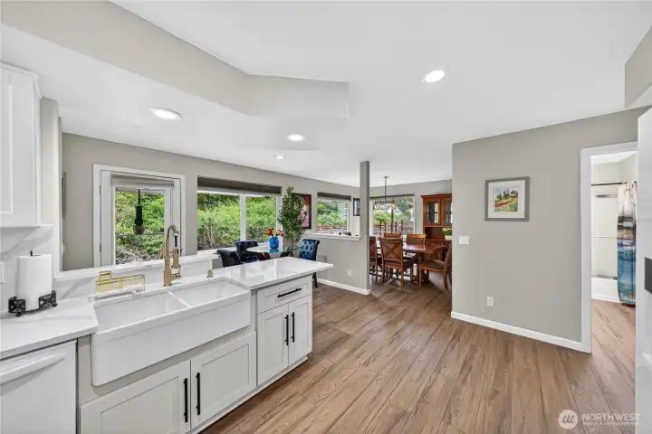 From the fully updated kitchen you can see the Bathroom on the Formal Dining Room on the Left.  Look at all the large windows!