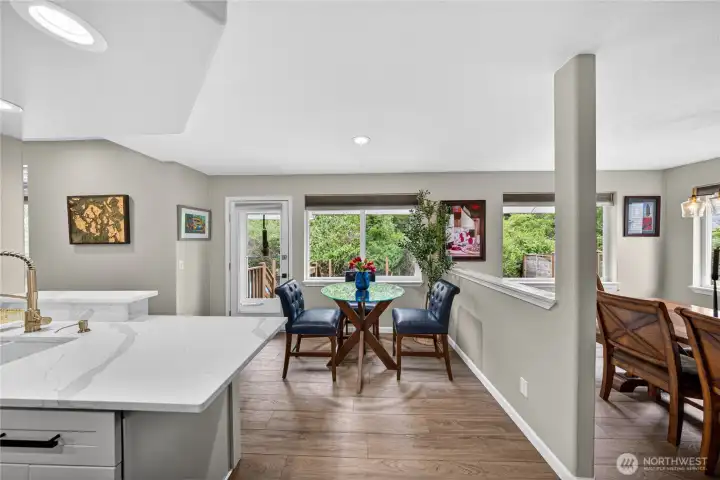 Just beyond the New Quartz Countertop you can see that there is a nice eating space as well as the formal Dining room.  There are lots of options for dining.  Theres even room to put a stool under the Countertop.