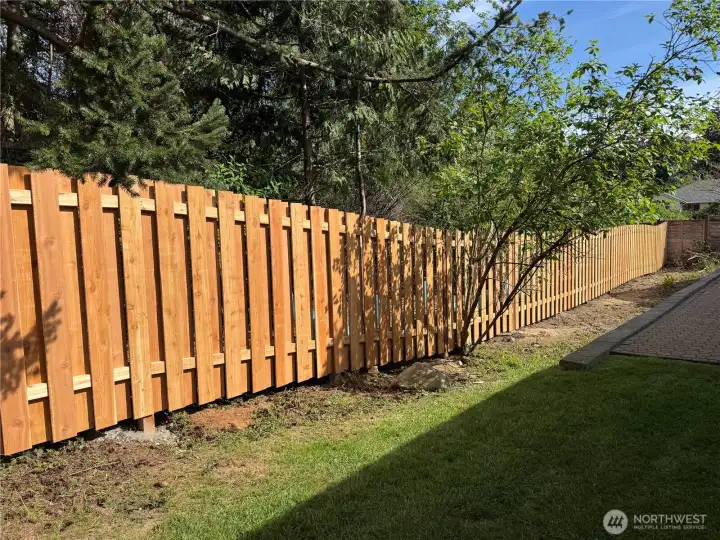 Here is the beautiful brand-new Fence which is gated and completes the fully fenced yard.  Safe for children or pets!