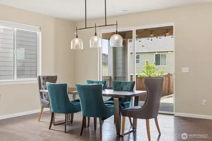 Generous dining area and slider to covered and uncovered patio