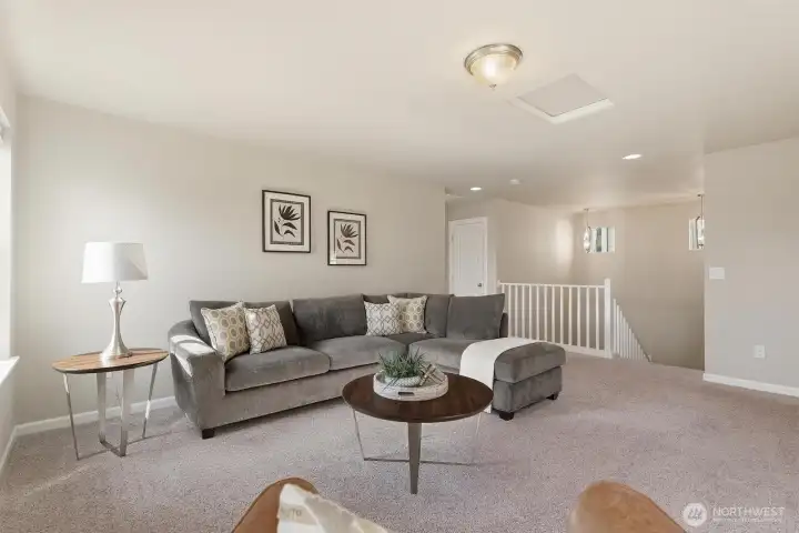Upstairs loft provides flexibility for office, media/play room, or potential 4th bedroom