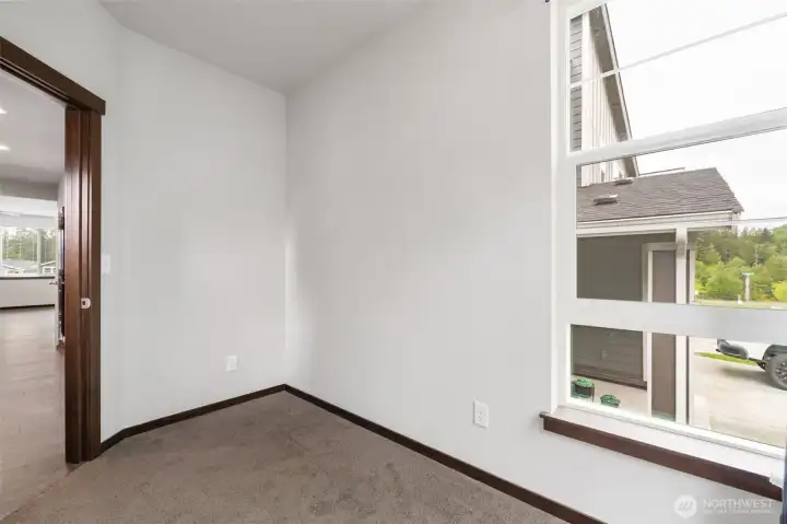 This front room gives you options from day one: a home office, den, reading nook, creative space, play area, or a simple retreat when you need a little separation from the rhythm of the rest of the home.