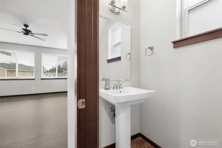A main floor powder room keeps the daily layout easy, giving you convenience near the living spaces without pulling anyone upstairs.