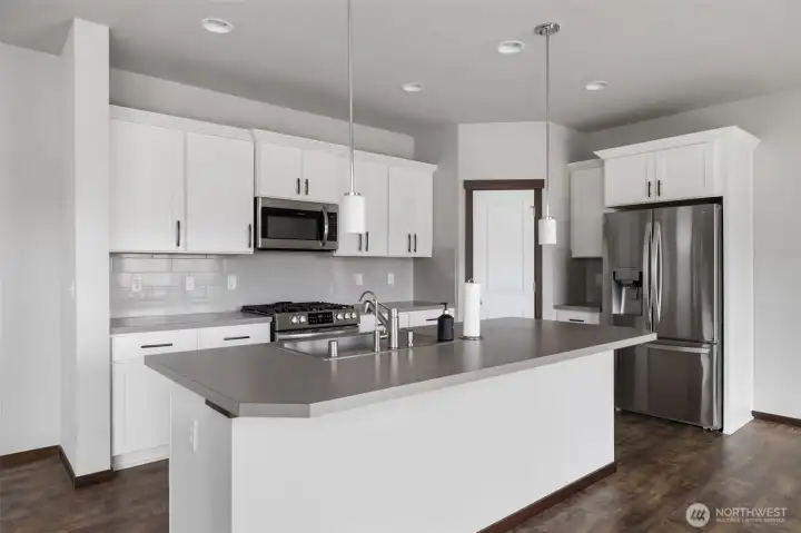 From morning coffee to a quick meal at the island, this kitchen is set up for the real rhythm of daily life, with prep space, storage, and gathering space all working together.