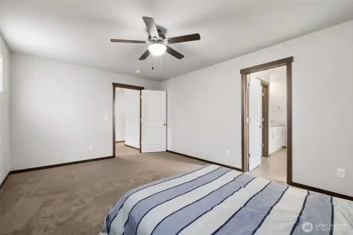 This room keeps the story simple: a comfortable place to land at the end of the day, with the bath just steps away when it is time to start fresh again.