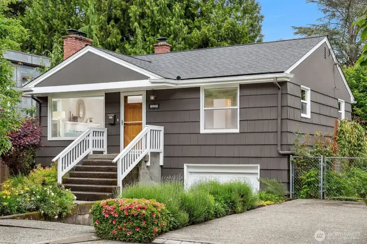 Charming Ravenna home with fresh exterior paint, updated windows, newer roof and multiple off street parking options.