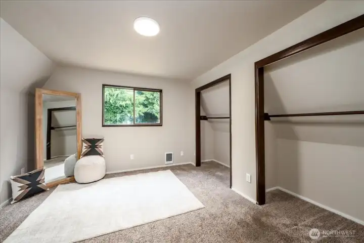 2nd bedroom on the upper floor across from the primary and 2nd full bath. Located at the top of the stairs on the right.