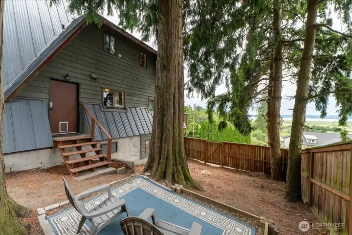 Your own private oasis off the laundry room. Enjoy a fire or create an outdoor kitchen.  Build a playhouse for hours of entertainment for the little ones....some many possibilities!