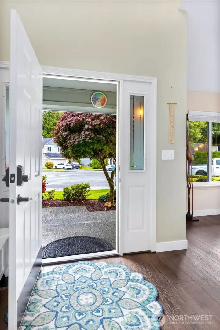 Welcome in to this light and bright entryway! New LV flooring throughout first level of home Welcome in to this light and bright entryway! New LV flooring throughout first level of home