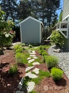 Another view of the side garden with the shed in the background Another view of the side garden with the shed in the background