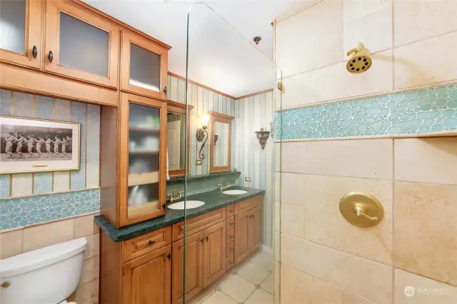 Bathroom features duel sinks and all new custom cabinetry with loads of storage