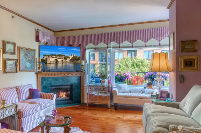 Living area viewed from kitchen features maple hardwoods, dining alcove, new gas fireplace and opens to the view Terrace