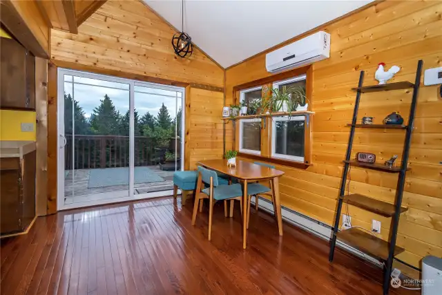 a nice sized eating area with a nice sliding door to the upper balcony and the viewing of wildlife and mountains this cabin has to offer