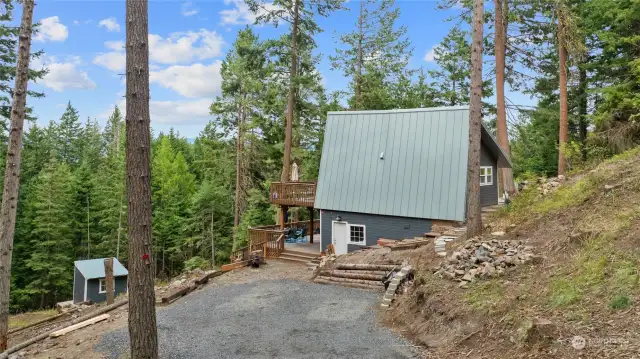 Tucked away on 1.68 acres, this well-built cabin offers a blend of charm, character, and modern updates.