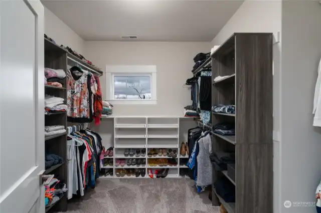 Wow! What a great primary closet with lots of natural light.