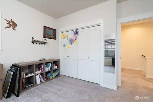 Another view of the upstairs bedroom .