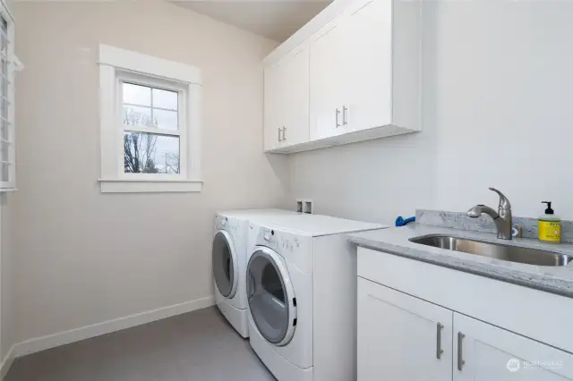 Nicely laid out upstairs laundry room makes doing laundry a breeze!