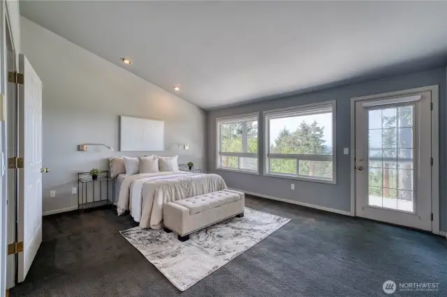 The primary bedroom not only has views, but also deck access.