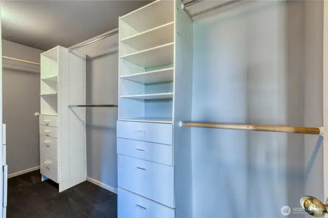 Nicely appointed primary closet is ready for your wardrobe!