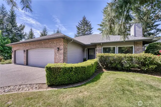 This daylight rambler lives like a single level home with primary suite and an additional bedroom on the main level.