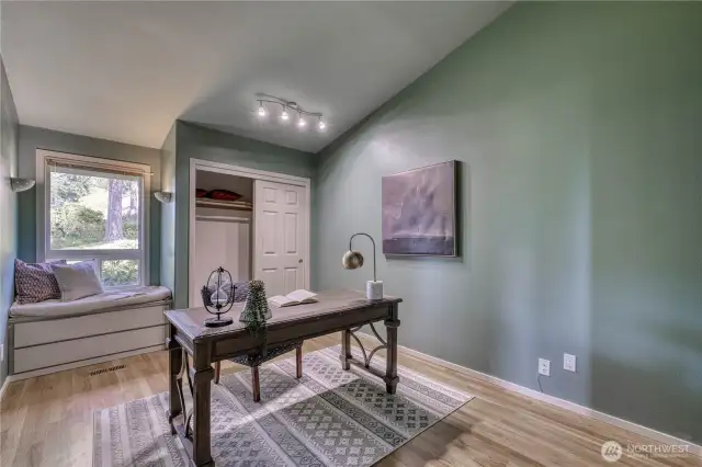 This is the second bedroom on the main floor, currently set up as an office, but how great would it be as a bedroom with that cozy window seat?