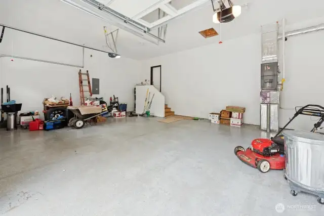 High ceiling 3 car garage. Plenty of storage/shop space.