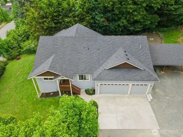 drone overhead of partial  lot. More property to right of home.