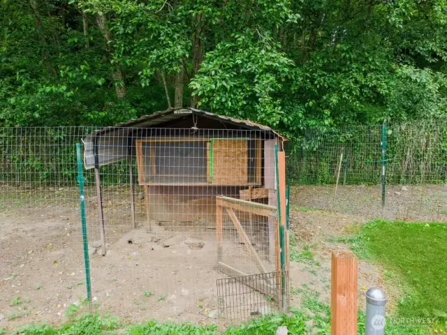 Chicken coop part of the property to right of carport.