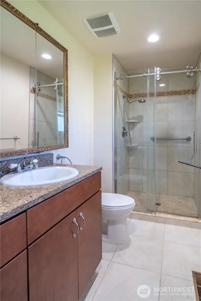 Primary Bathroom with walk in shower and granite
