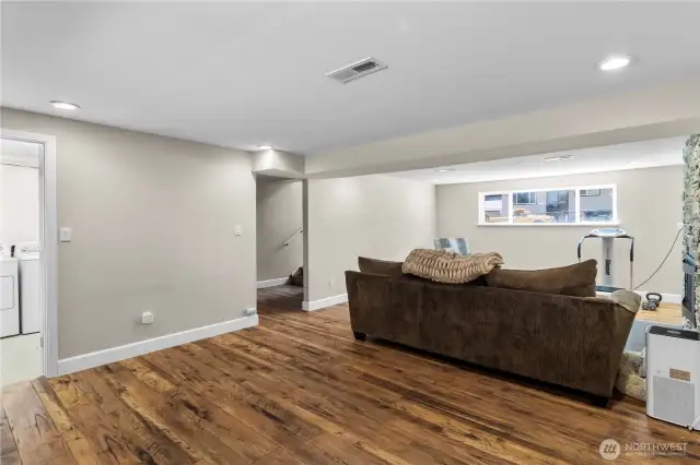 LOWER GREAT ROOM - Facing Hallway Stairs, Utility Rm on left...