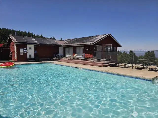 Beautiful outdoor swimming pool just down the road from your cabin in the woods...