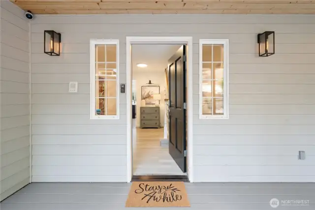 Classic covered front porch facing east for morning light.