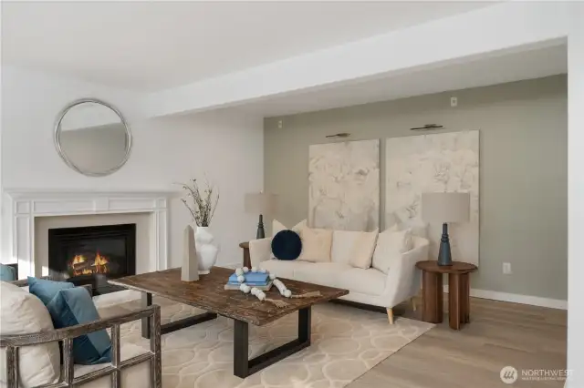 Spacious casual room with gas fireplace adjoins the gourmet kitchen with a wall of west facing windows to capture the view of the lake.